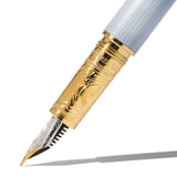 Elegant fountain pen with Forget Me Not floral design, featuring a medium nib for smooth writing. Ideal for creative expression.
