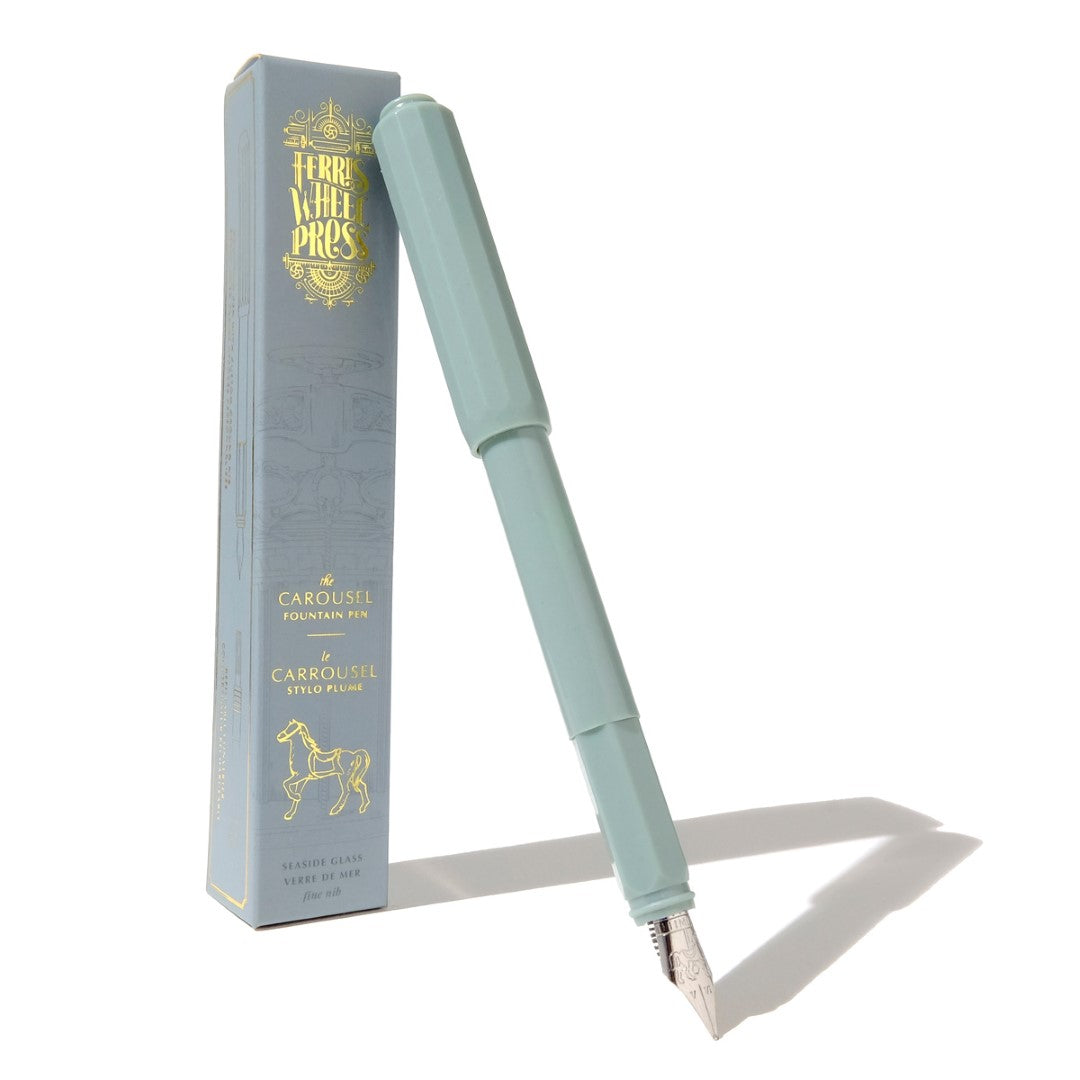 Ferris Wheel Press fountain pen in Seaside Glass, featuring a glossy acrylic body and custom-ground nib for joyful writing.