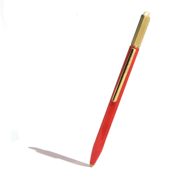 Ferris Wheel Press The Scribe Red Carpet Ballpoint Pen features a glossy copper body, brass crown, and smooth archival ink.