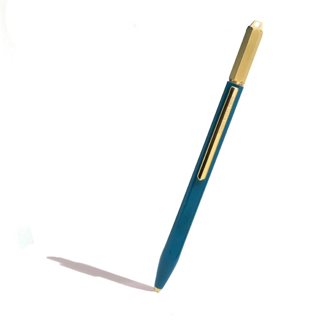 Ferris Wheel Press Scribe ballpoint pen in Tattlers Teal, featuring a glossy copper body and engraved brass crown.