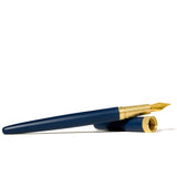 Ferris Wheel Press Fountain Pen in Crystal Blue with 14k gold nib, showcasing luxurious satin finish and engraved brass grip.