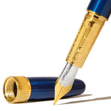 Elegant brass fountain pen with Sapphire Lacquer finish, gold-plated details, and a two-tone steel nib for smooth writing.