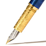 Ferris Wheel Press Bijou Luna Celeste fountain pen in Sapphire Lacquer with two-tone nib and gold plated brass grip.