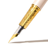 Elegant Ferris Wheel Press Joule fountain pen in Chantilly Lacewood, featuring gold plating, a two-tone nib, and leather sleeve.