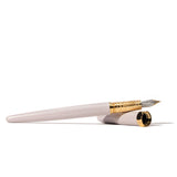 Elegant Ferris Wheel Press fountain pen in Bijou Sandcastle Clay, featuring a dual-toned nib and intricate engraved design.