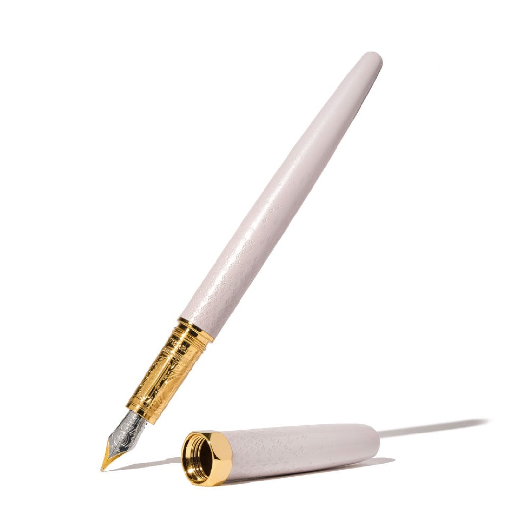 Ferris Wheel Press Bijou Sandcastle Clay Fountain Pen showcasing elegant lacquer, intricate engraving, and smooth two-tone nib.