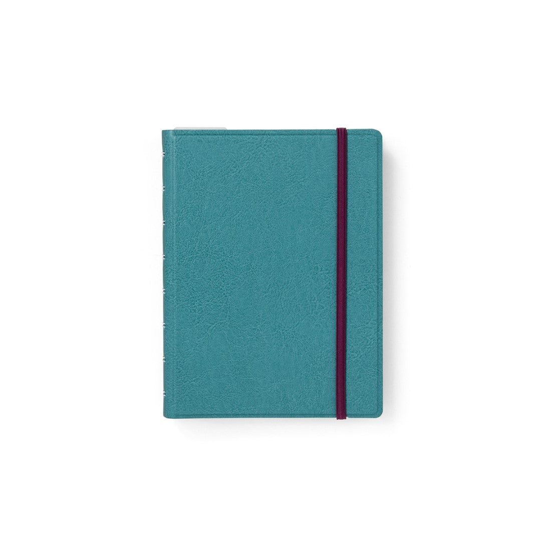 Contemporary teal A5 refillable notebook with twin-wire binding, 56 fountain pen-friendly pages, and elastic closure.