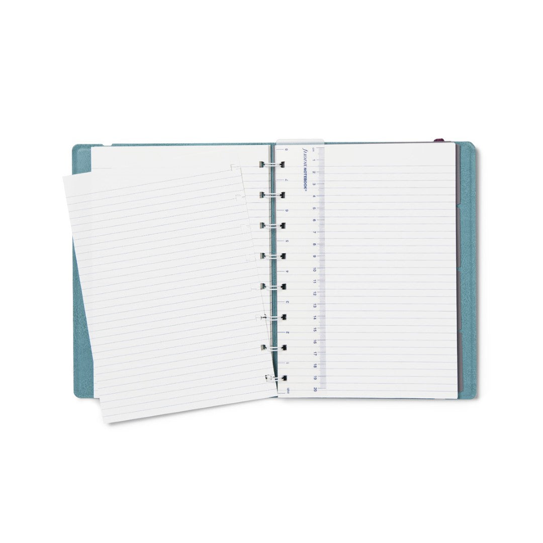 Contemporary teal A5 refillable notebook with twin-wire binding, ruled pages, and elastic closure for stylish note-taking.