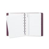 Filofax A5 refillable notebook in plum with lined pages, twin-wire binding, and elastic closure for organized note-taking.