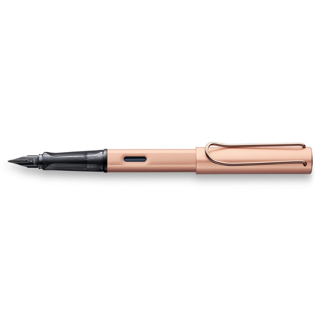 Lamy Lx Fountain Pen in Rose Gold with extra fine nib, ergonomic grip, and polished black steel nib for elegant writing.