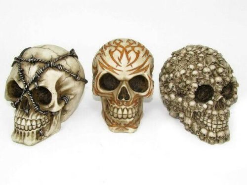 Set of 3 assorted 12cm skull head ornaments for spooky home decor, perfect for Halloween or gothic styling.