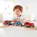 Colorful wooden Hape Race Car Transporter for kids, featuring vibrant vehicles and designed to inspire imaginative play.