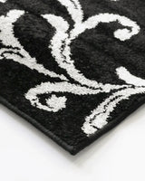 Stylish black and grey multi-pattern floor rug, 160x235cm, crafted from soft heatset polypropylene for durability and luxury.