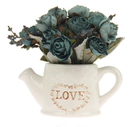 Set of 2 blue ceramic watering cans with fabric roses, perfect for vibrant home decor and floral touches.