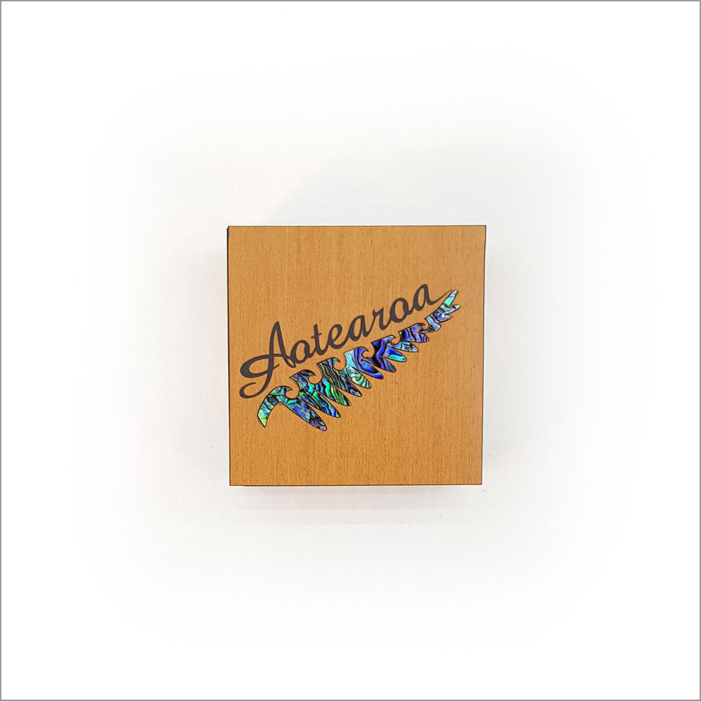 Small trinket box made of NZ Silver Beech veneer with Rimu design and inlaid Paua, perfect for storing keepsakes.