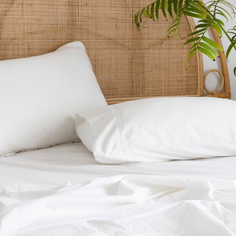 Luxurious Queen Sheet Set in Ivory, made from GOTS-certified organic cotton for softness, breathability, and eco-friendliness.