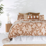 Single duvet cover set in warm biscuit and pale peach with floral patterns, crafted from high-quality cotton sateen.