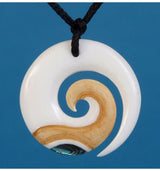 Bone Koru Stained Pendant featuring intricate Paua detailing, symbolizing growth and handcrafted uniqueness.