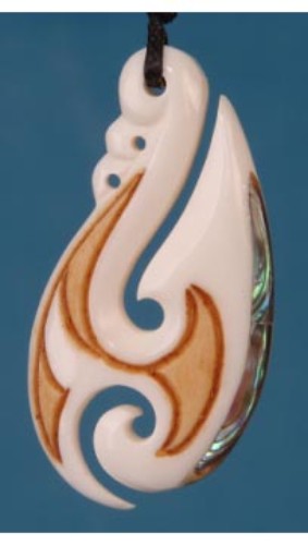 Bone stylized hook pendant with Paua shell inlay, symbolizing good fortune and safe travels, showcasing Maori artistry.