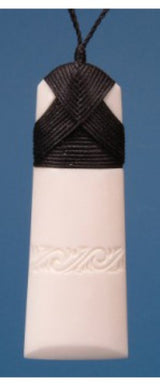 Engraved large toki pendant in bone, symbolizing strength and peace, on an adjustable cord, packaged in a flax kete.