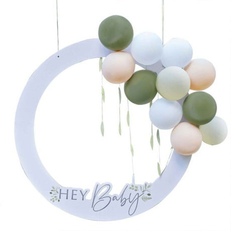 Botanical Baby Shower photo booth frame with balloons and leaf decor for capturing fun memories at your celebration.