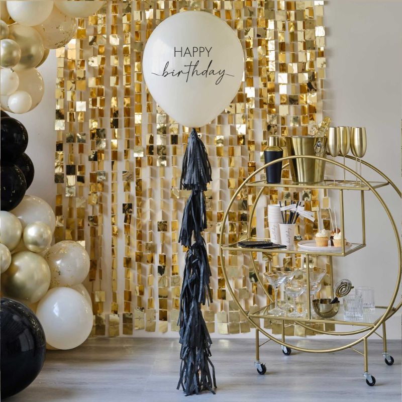 Elegant 24-inch Champagne Noir Happy Birthday balloon with a black tassel tail, perfect for sophisticated celebrations.