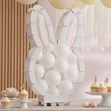 Bunny-shaped balloon mosaic stand for Easter, includes balloons, ears, eyes, and supportive foam pads.