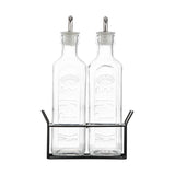 Two elegant 600ml glass oil bottles with precision pourers and a metal rack, perfect for stylish kitchen storage.