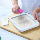 Instant Ice Cream Maker with stainless steel surface, makes desserts quickly without electricity, perfect for family fun.