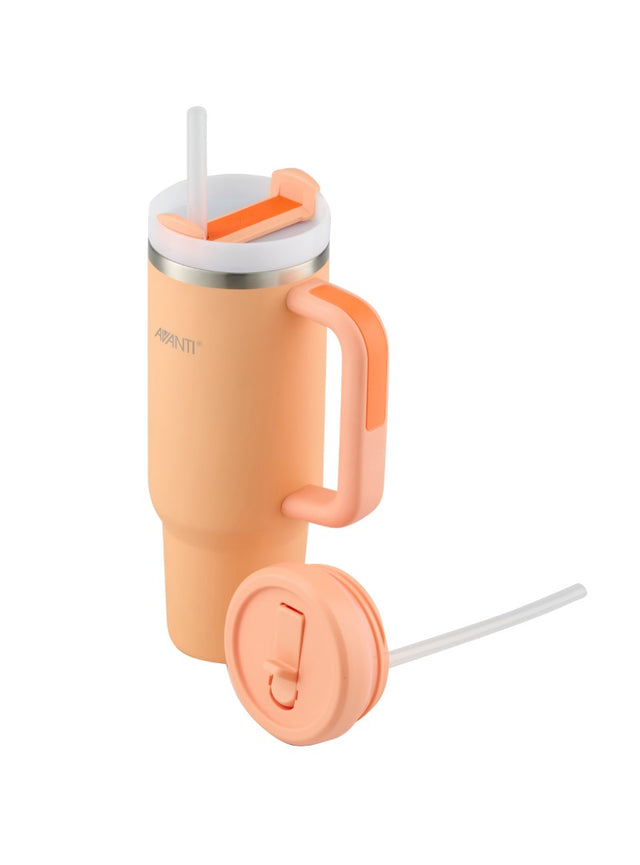 Peach-colored 1L tumbler with double wall insulation, ergonomic handle, and two leak-proof lids for versatile sipping.