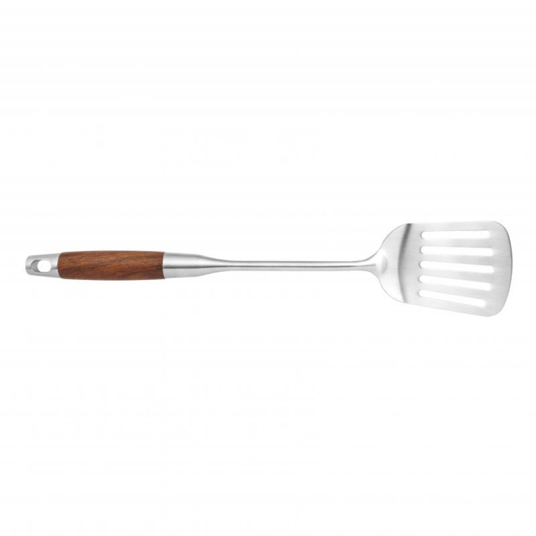 Wok slotted turner with a sturdy handle, designed for flipping and draining excess oil from sautéed foods.