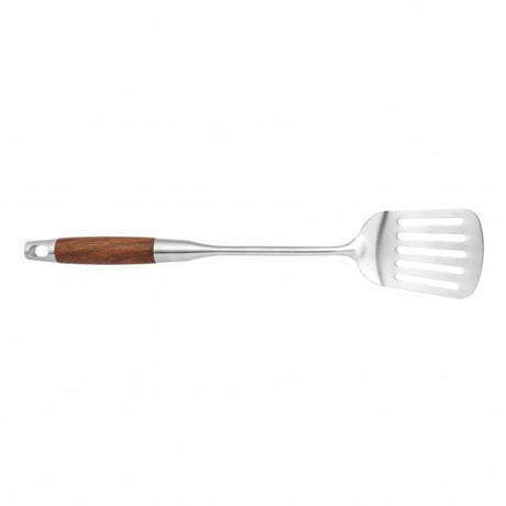 Wok slotted turner with a sturdy handle, designed for flipping and draining excess oil from sautéed foods.