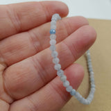 Elegant set of 3 star cut faceted aquamarine bracelets, featuring 3mm beads on an adjustable string for a perfect fit.