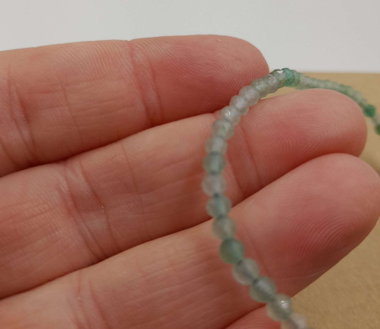 Set of 3 star cut faceted green aventurine bracelets, featuring adjustable strings for a perfect fit and elegant 3mm design.