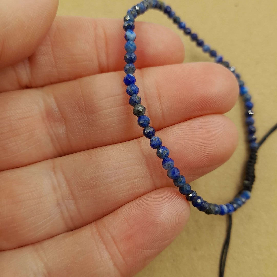 Set of 3 adjustable gemstone bracelets featuring star cut faceted lapis lazuli beads with golden pyrite flecks.