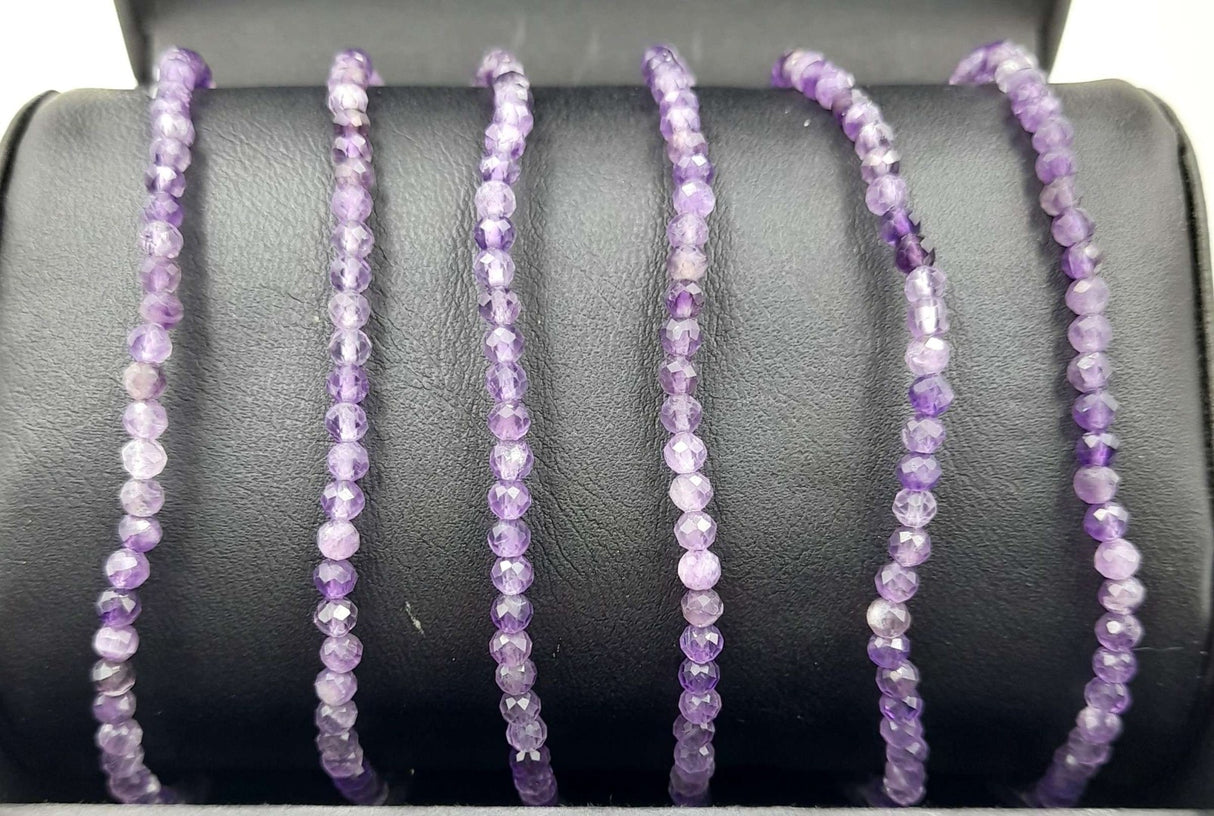 Set of 3 star cut faceted amethyst bracelets, adjustable strings, elegant purple hues for stylish layering or gifting.