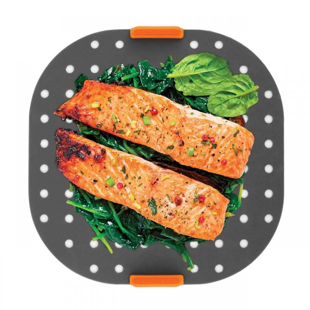 BAKEMASTER silicone air fryer liner (21x21cm) protects baskets, ensuring crispy meals and easy cleanup with perforated design.