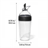 Black OXO Good Grips Salad Dressing Shaker with measurement markings, ideal for mixing and storing dressings and sauces.