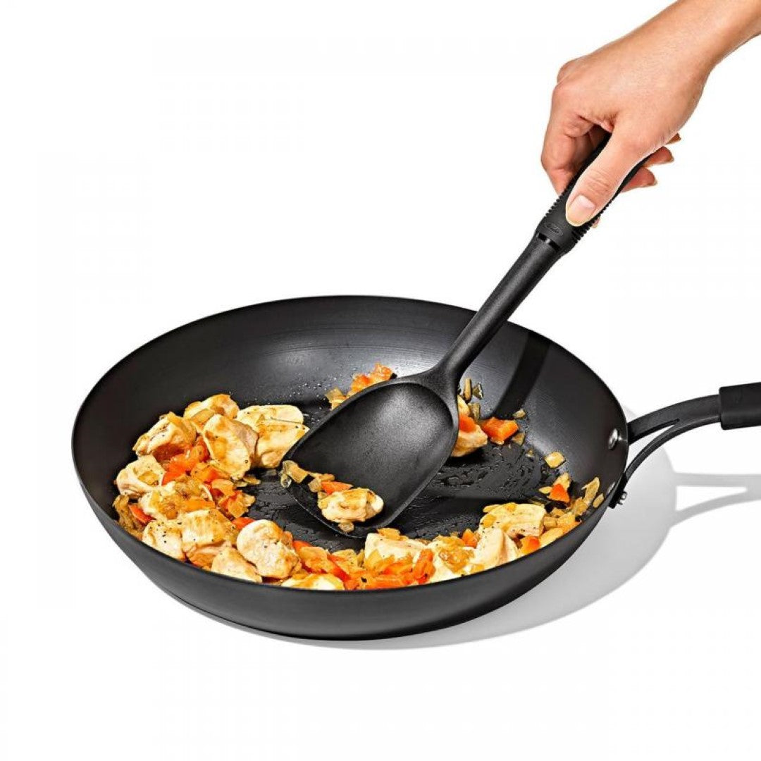 OXO Good Grips Nylon Saute Spoon with shallow scoop, flat edge, soft grip handle, safe for non-stick cookware, and dishwasher safe.