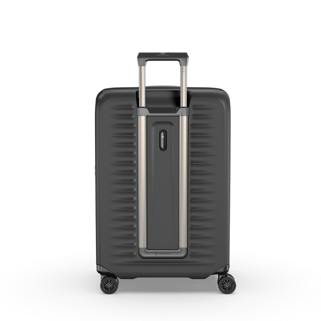 "VICTORINOX Airox Advanced Medium Hardside Case in black, featuring elastic compression straps and an expansion system for travel."