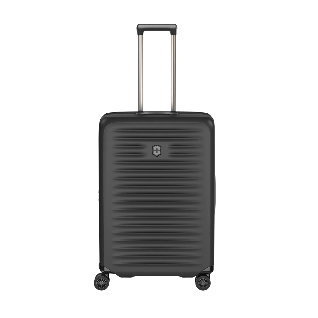 VICTORINOX Airox Advanced Medium Hardside Case in black, featuring elastic compression straps and an expansion system for extra packing space.