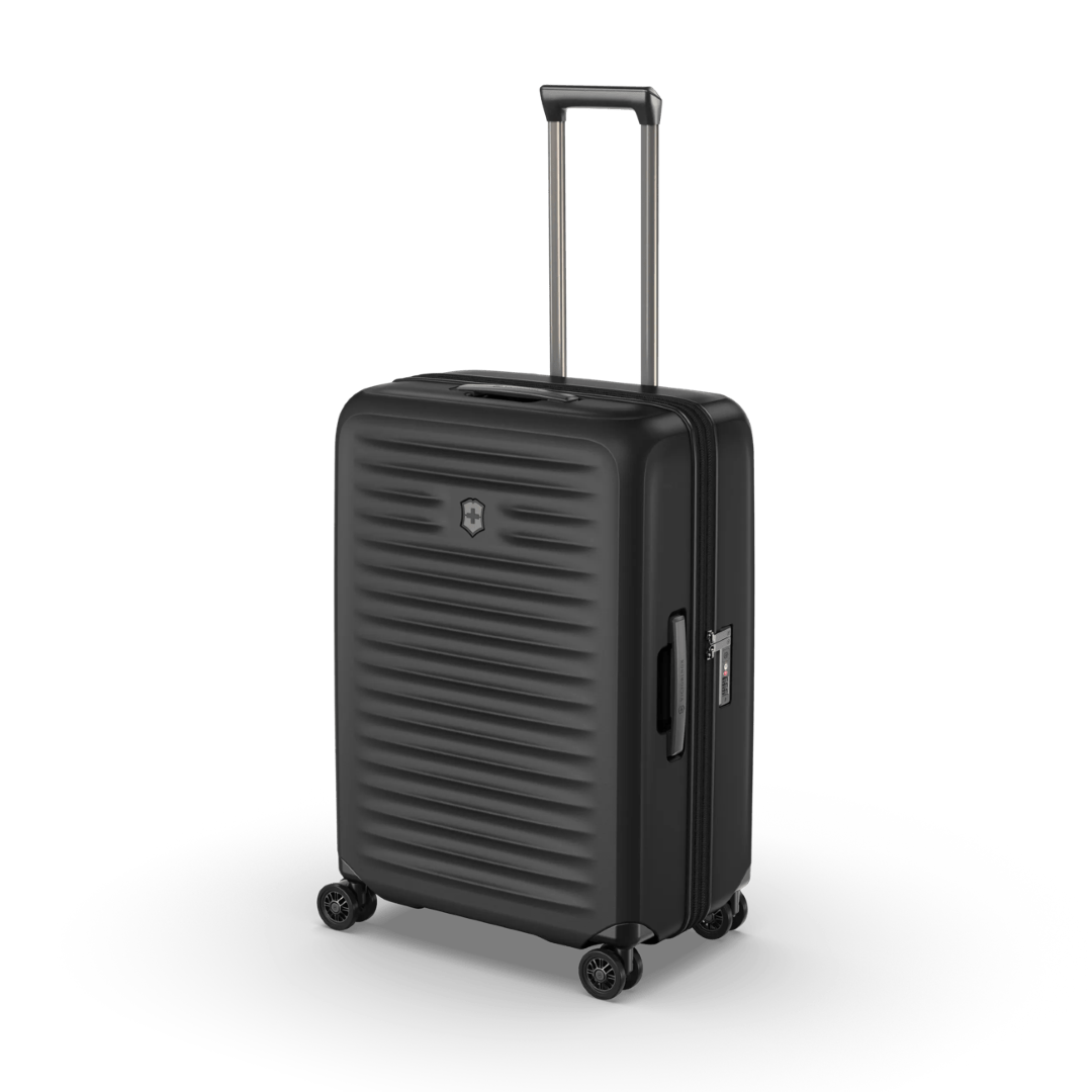 Sleek black VICTORINOX Airox Advanced Medium Hardside Case with compression straps and expansion system for effortless travel.