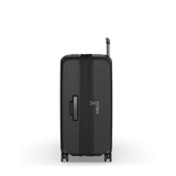 Hardside black suitcase with expansion system, elastic straps, and dual-caster wheels for easy maneuverability.