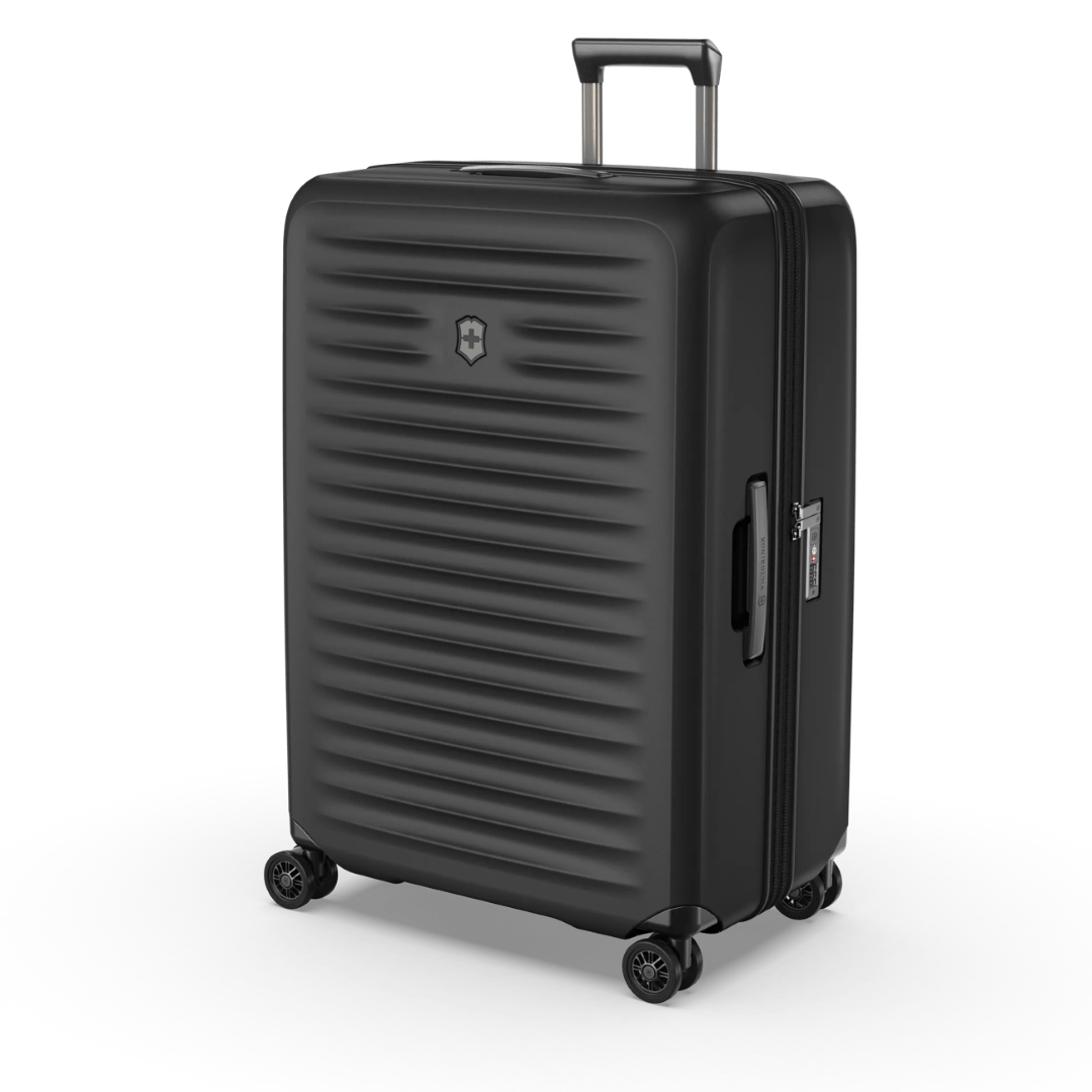 Hardside black suitcase with elastic straps, expansion system, and 4 dual caster wheels for flexible travel.