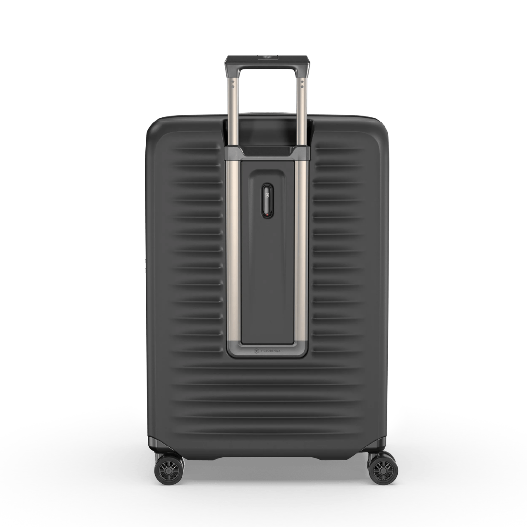 Large black hardside suitcase with expansion system, elastic straps, and 4 dual caster wheels for smooth maneuverability.