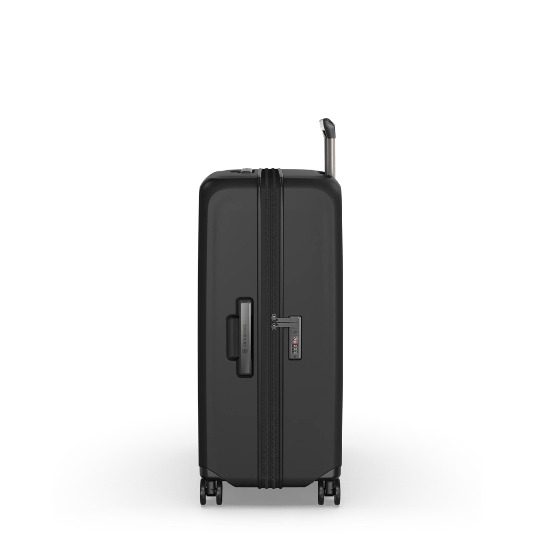 Black VICTORINOX Airox Advanced Large hardside case with expansion, X-shaped straps, and four dual spinner wheels.