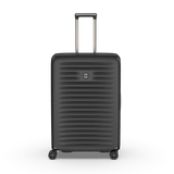 Lightweight black hardside case with expandable capacity, featuring compression straps and a sleek design for travel flexibility.