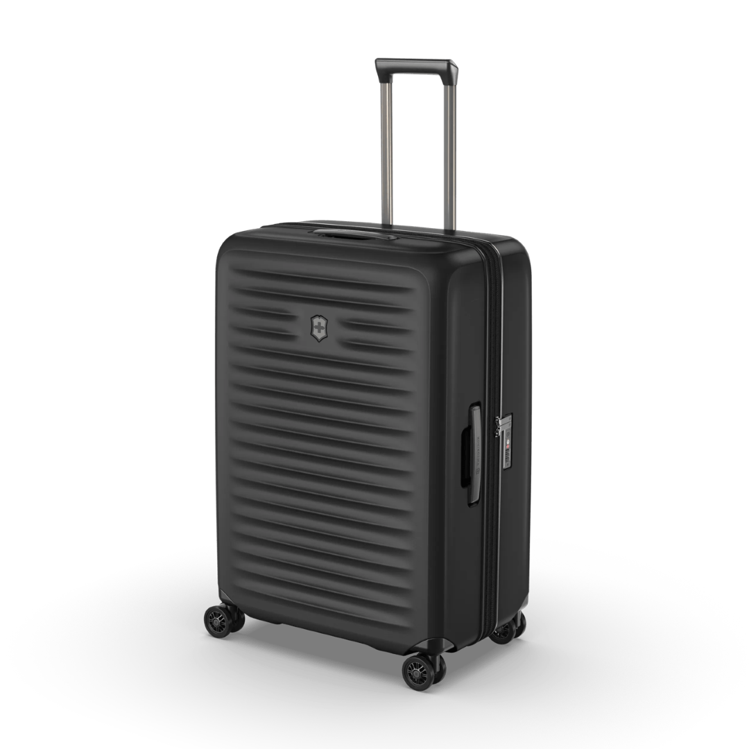 Hardside black suitcase with expandable system, compression straps, and lightweight design for effortless travel.