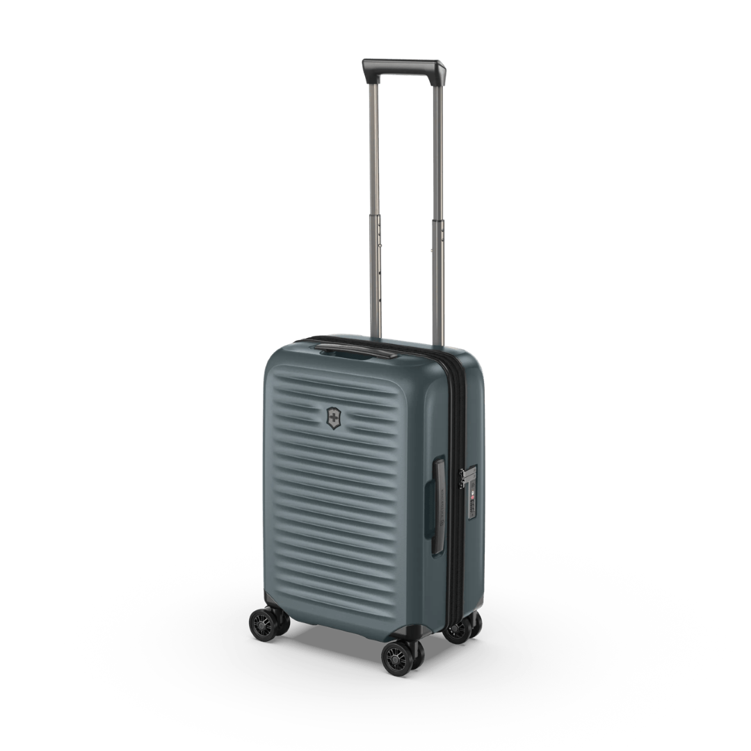 Lightweight green hardside carry-on with anti-scratch pocket, expandable capacity, and smooth 4-wheel mobility.