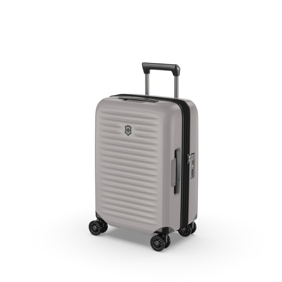 Lightweight white hardside carry-on suitcase with expandable capacity, anti-scratch pocket, and smooth dual caster wheels.